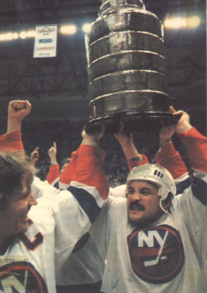 Trottier hoists the cup